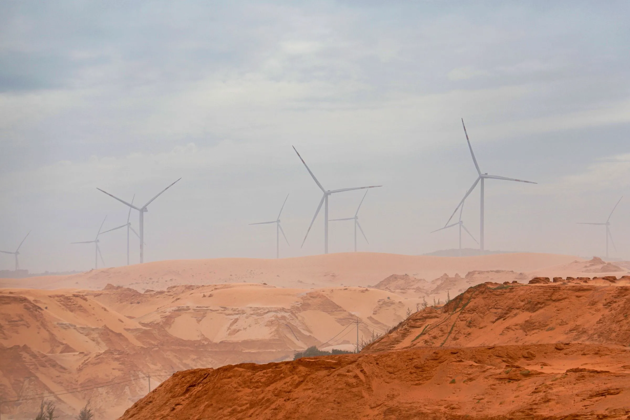 Wind turbines above the sand dunes of Binh Thuan, Vietnam