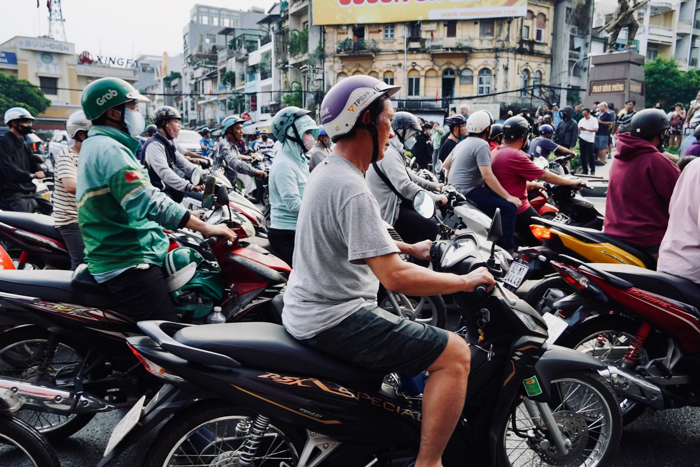 Motorbike riders waiting at a traffic light