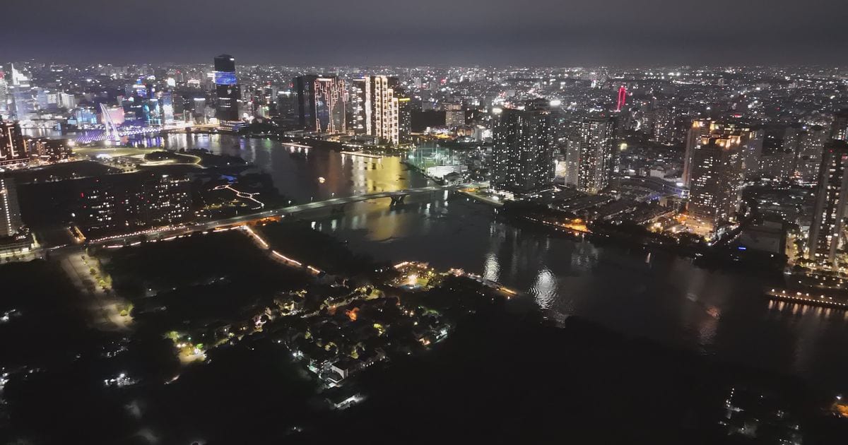 Aerial view of Ho Chi Minh City and the Saigon River at night