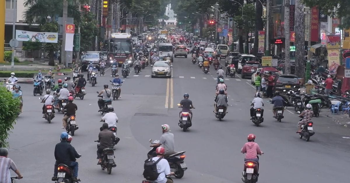 Daytime motorbike traffic on a street in Ho Chi Minh City